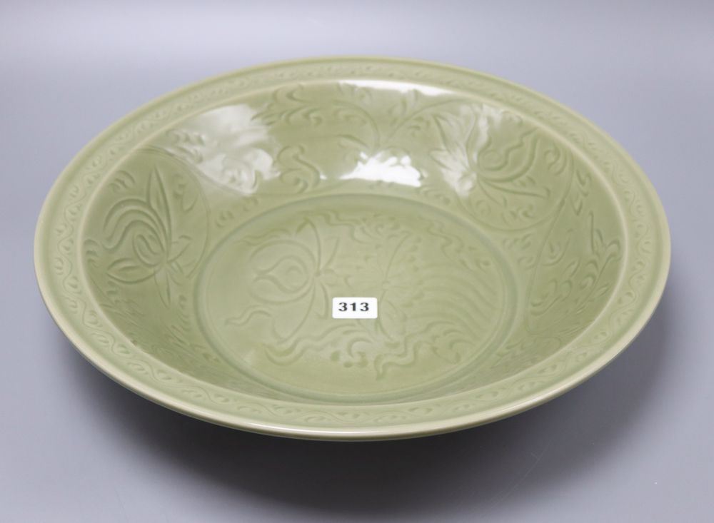 A Chinese celadon glazed bowl, Ming dynasty, diameter 43cm
